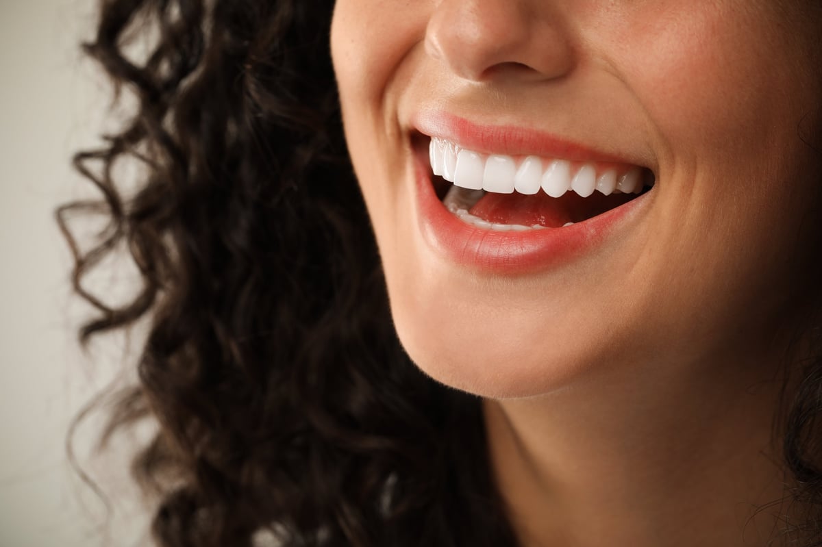 Confident patient smile — the result of quality cosmetic dentistry